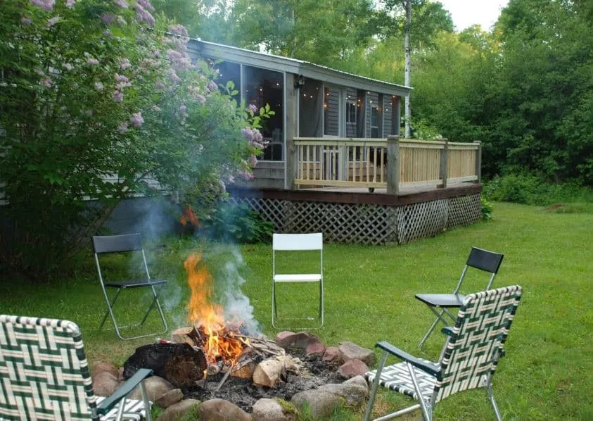 graden with a fire pit and a bonfire at Wooded Escape at Northshore Apostle Island Wisconsin - 14 Unique Airbnbs in Apostle Islands