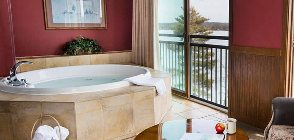 hot tub in a room with lake views at the Wilderness on the Lake. Best hotels in Wisconsin Dells