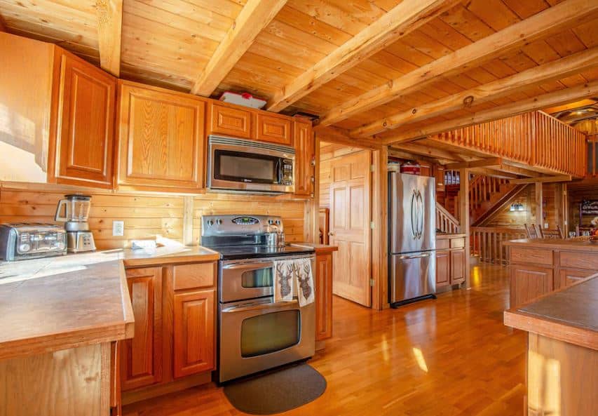 kitchen area with linving room at the rustic Nature Lovers Paradise Lafayette Wisconsin - 15 Best Family Cabins in Wisconsin