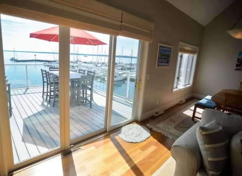 living room view with the lake at Bayfield on the Lake Wisconsin - 13 Best Lake Cabins in Wisconsin