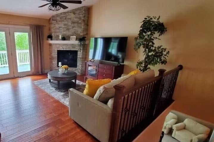 living room with sofa fire place and a tv at Cozy Lake Geneva Home Wisconsin - 10 Best Airbnbs in Lake Geneva, Wisconsin