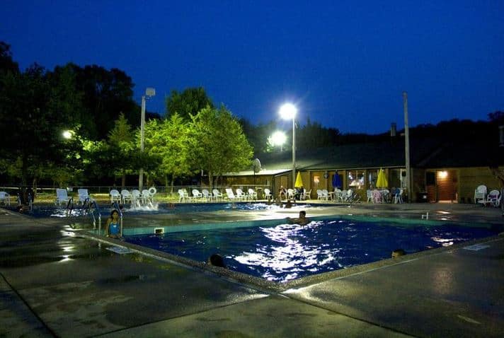 outdoor pool at night at Arrowhead Resort Campground