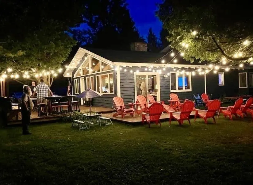 people having a grill at night at the Newly Renovated Waterfront Home wisconsin - 15 Best Family Cabins in Wisconsin