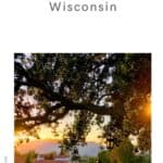 a pin with one of the best hotels in Door County, Wisconsin at sunset and surrounded by green areas.