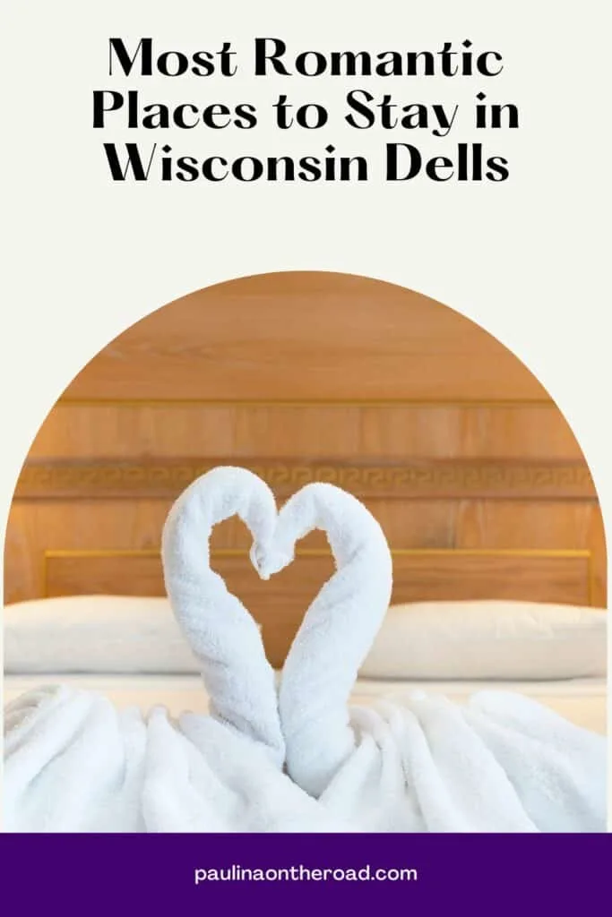 a pin with towel swans on a bed at romantic places to stay in wisconsin dells. 