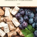 Pin with image of decorative wine corks next to red grapes in a box, text above image reads: magical wineries in Southern Wisconsin, USA