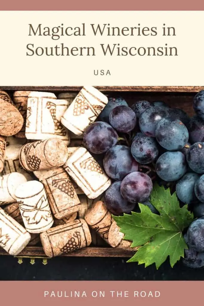 Pin with image of decorative wine corks next to red grapes in a box, text above image reads: magical wineries in Southern Wisconsin, USA