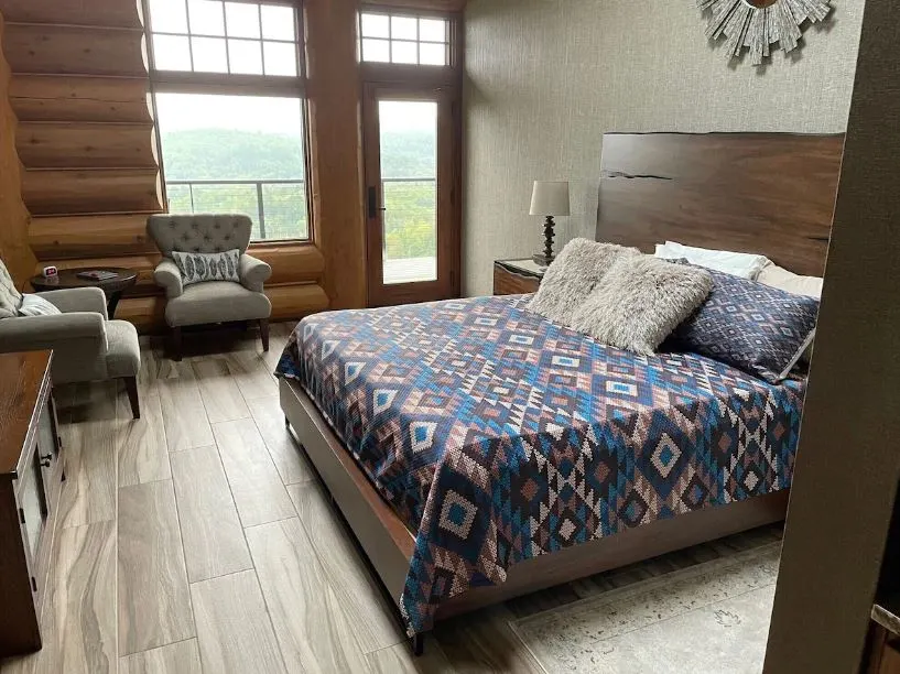 a cozy wooden bedroom at the Mont du Lac Resort Carlton - 10 Fun Snowmobile Resorts in Wisconsin