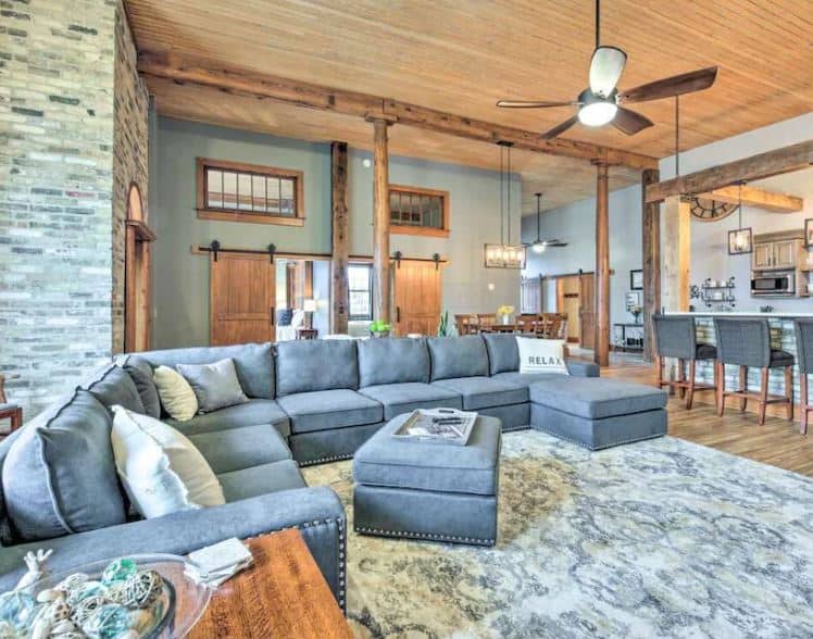 beautifully decorated living room with kitchen area Downtown condo with game room racine wisconsin - 15 Best Airbnbs in Racine, WI