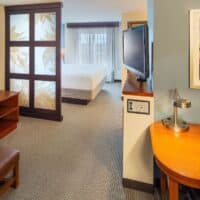 cozy room with a sofa, tv and bedroom at the one of the best western Wisconsin resorts