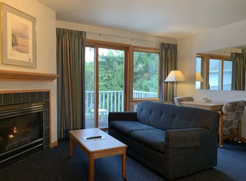 honeymoon suit at AppleCreek Resort Wisconsin with a fire place sofa and a balcony - 12 Gorgeous Lakefront Resorts in Wisconsin