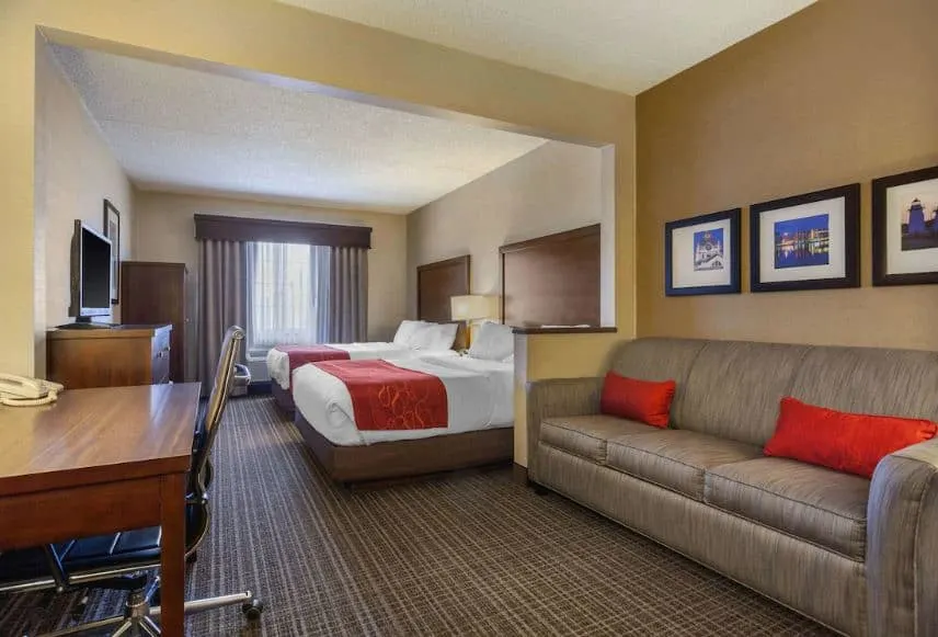 interior of a room with bed, sofa and a desk at the Comfort Suites, Green Bay, WI