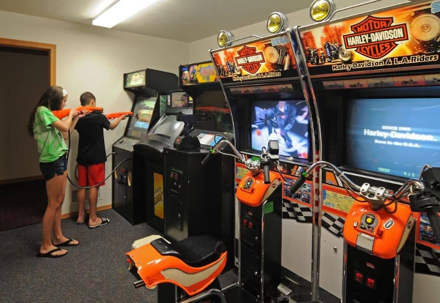 kid playing in a game room at the newport resort in Egg Harbor, Wisconsin