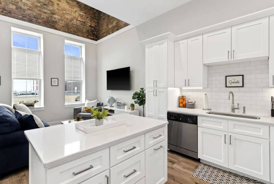 kitchen and living room areas at the The Graduate on Main Street Racine Wisconsin - 15 Best Airbnbs in Racine, Wisconsin