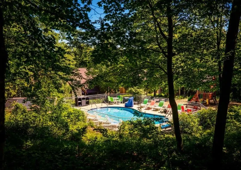secluded pool surrounded by forest at the The Inn at Little Sister Hill, Door County