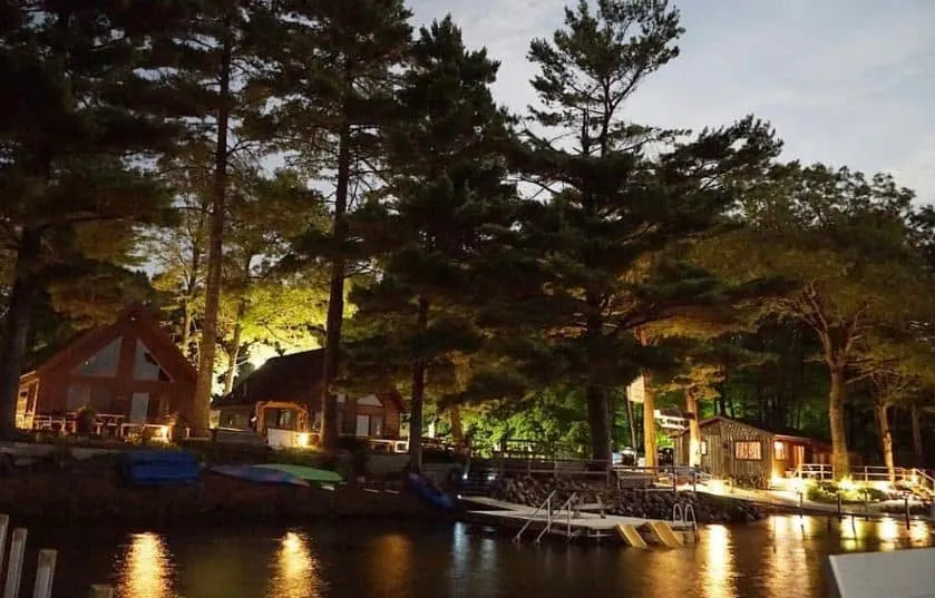 the Angler's Haven Resort in Hayward, Wisconsin at night with lakefront location.