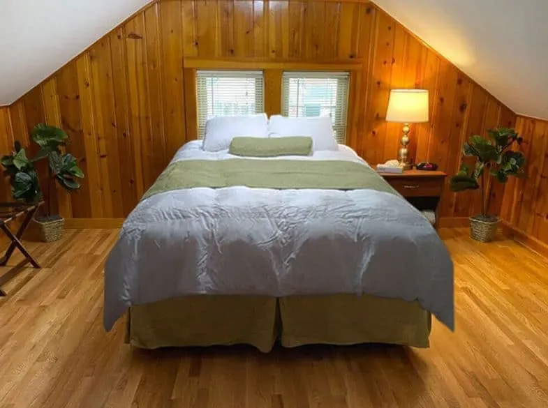 wooden bedroom at the Homes By Christopher racine wisconsin - 15 Best Airbnbs in Racine, WI