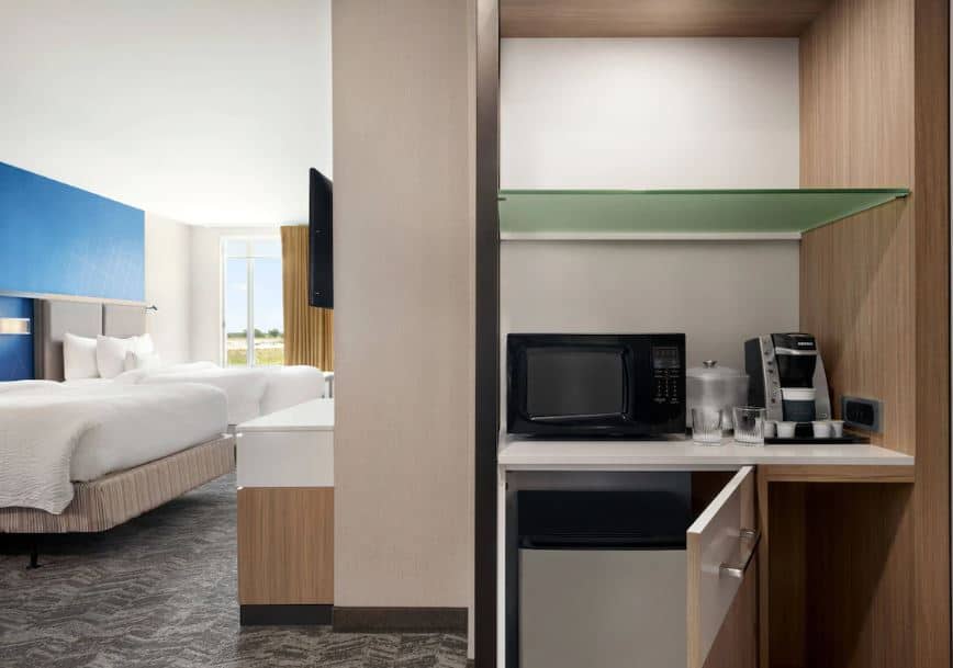 interior of a room with 2 beds, microwave, coffee machine and fridge at SpringHill Suites by Marriott Milwaukee West, Wisconsin