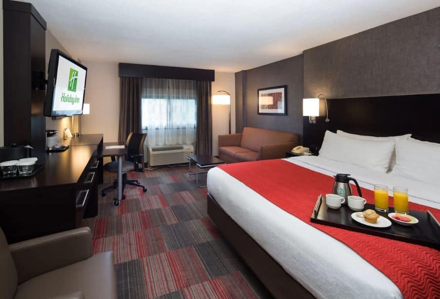 lovely room with bed, desk, Tv and sofa at Holiday Inn Milwaukee Riverfront, an IHG Hotel, Wisconsin