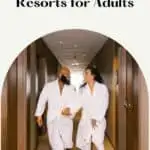 a pin with a couple in bath robes at one of the best Wisconsin Dells resorts for adults.