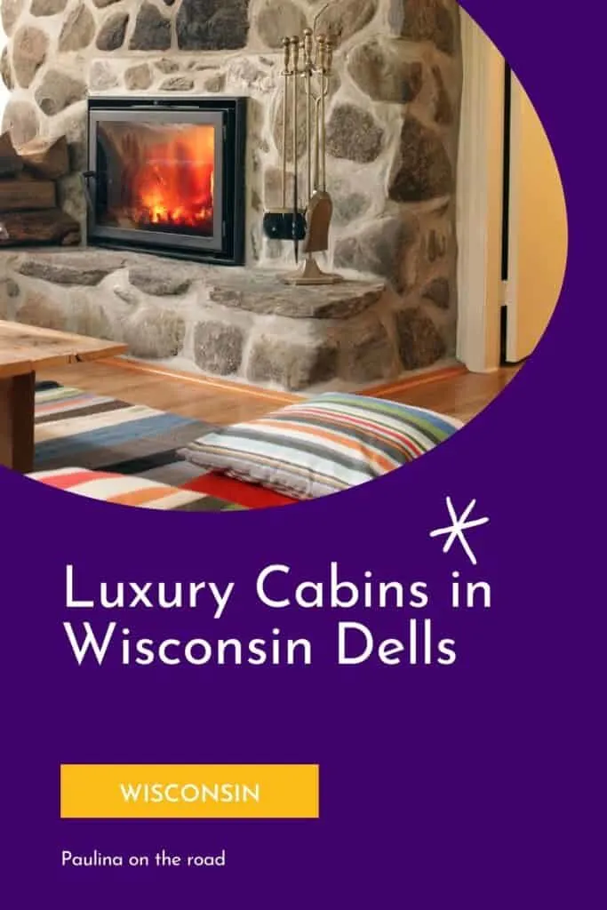 a pin with a fire place in a living room at one of the best luxury cabins in Wisconsin Dells. 