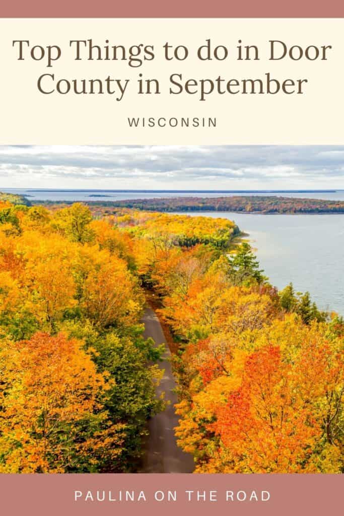 Pin with image of colorful fall trees densely lining a road leading towards a small island surrounded by a calm body of water on a cloudy day, caption reads: Top Things to do in Door County in September from Paulina on the Road