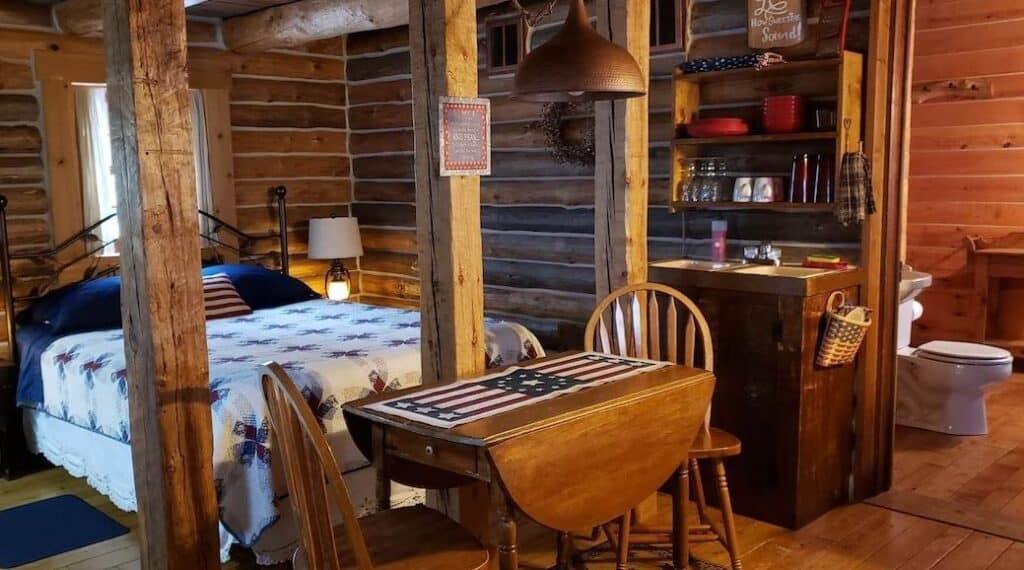 bedroom and dining table at the Rustic Log Cabin - Rhinelander, Wisconsin