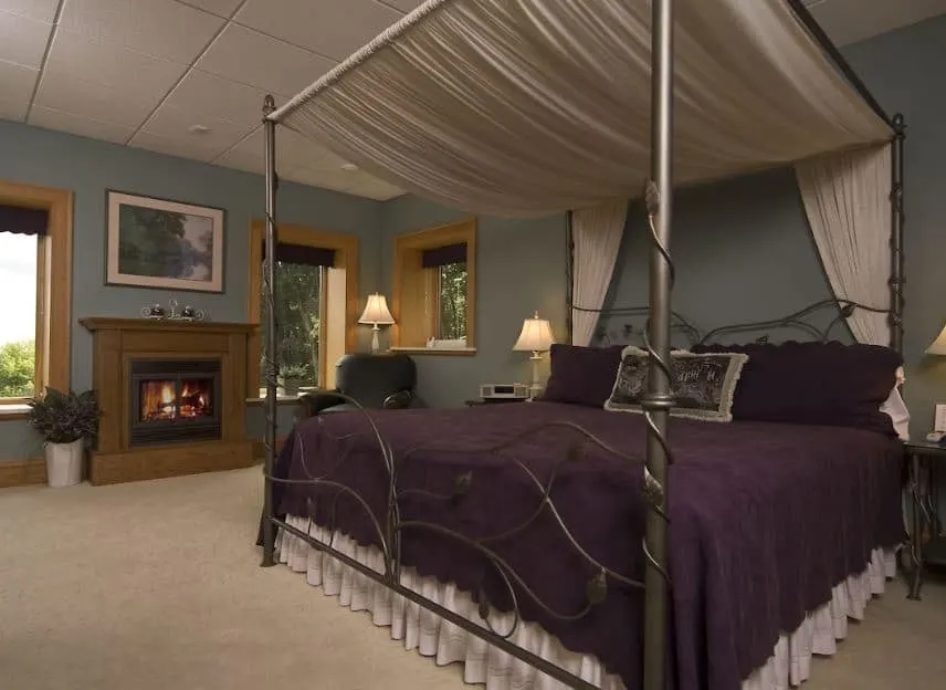 bedroom with fire place at Inn at Wawanissee Point in Wisconsin Dells