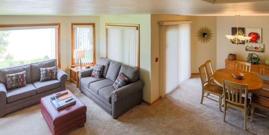 living room with dining area and sofa at Glidden Lodge Beach Resort, Sturgeon Bay, Wisconsin