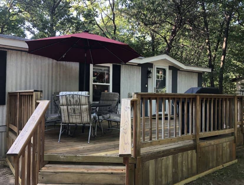 porch area with dining table and grill at Arbor Lake Getaway in Wisconsin Dells