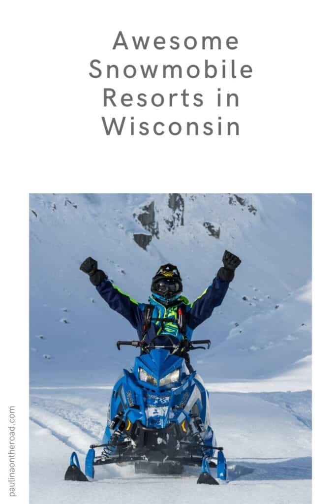 a pin with a man on a snowmobile at one of the best snowmobile resorts in Wisconsin.