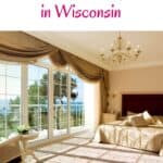 a pin with a bedroom with large windows at one of the best vacation resorts in Wisconsin.