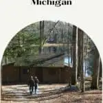 a pin with a couple walking around one of the best door county cabins on lake michigan