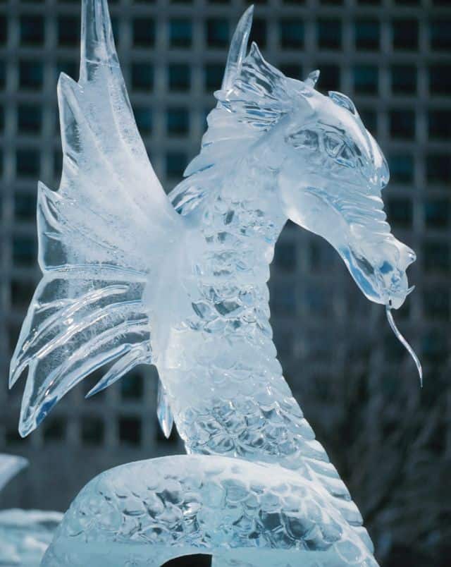 what to do in Milwaukee in January, Close up shot of an ice sculpture of a scaly winged dragon with a flicking tongue