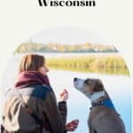 a pin with a girl and her dog by the lake at one of the best pet-friendly lake cabins in Wisconsin.
