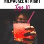 Pin with image of close-up shot of a bright red cocktail drink with long red straw being held towards the viewer by a bartender dressed all in black, caption reads: Things to do in Milwaukee at Night, Top 10 from paulinaontheroad.com