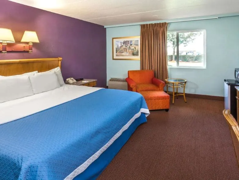 winter destinations in wisconsin, bedroom with sofa, fridge, TV at Days Inn by Wyndham Portage, Wisconsin