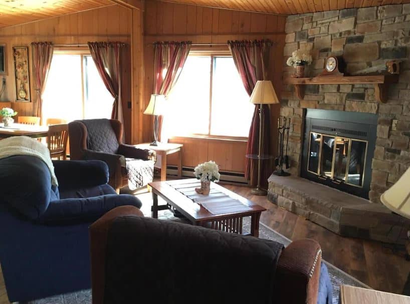 cozy living room with sofas and fire place at the Relaxing Getaway with Scenic Beauty, Wisconsin Dells