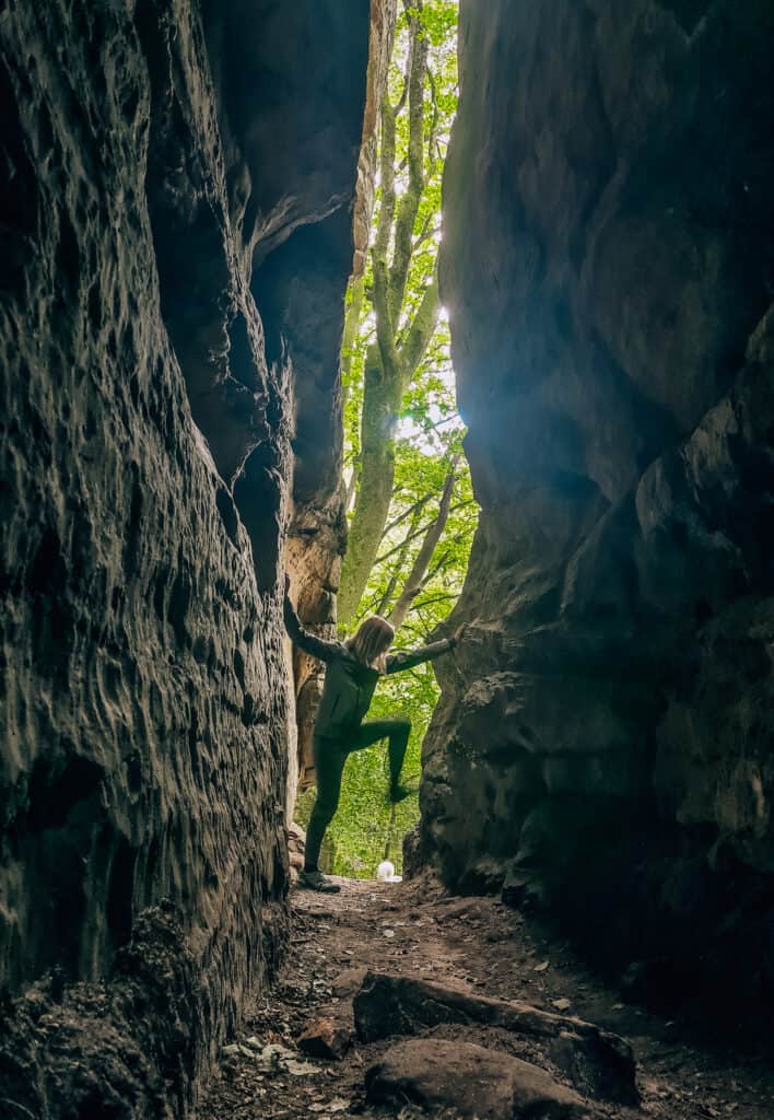 exploring caves in mullerthal, luxembourg
