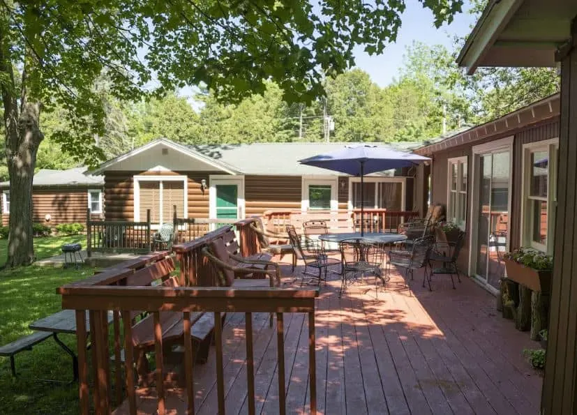 outdoor area with chairs, bbq and fire place at the Corner Cabin Pet-Friendly in Williams Bay, Wisconsin