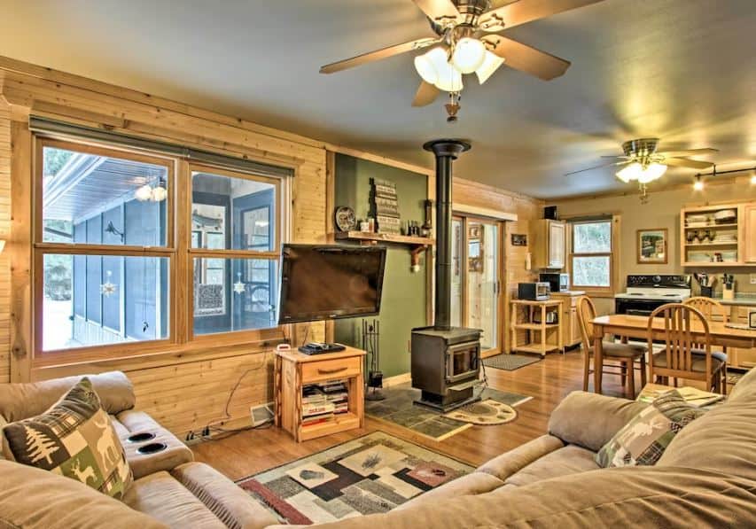 wooden living room with sofa, TV and sitting area at the Cabin on Wisconsin River