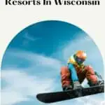 a pin with a man jumping with its snowboard at one of the Best Snowboarding Resorts in Wisconsin