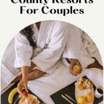 a pin with a couple eating in bed at one of the best Door County resorts for couples.