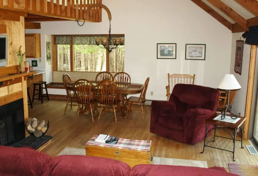 Evans Woods Cottage with fire place and dining table in Door County, Wi