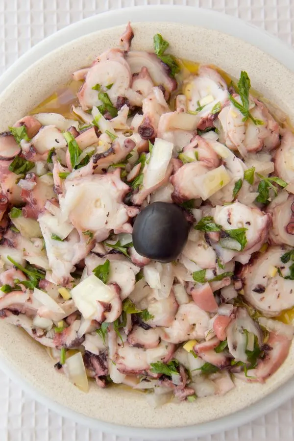 an octopus salad in a restaurant in the village of Luz at the Algarve of Portugal in Europe