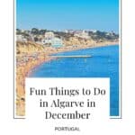 Pin with image of coastal beach containing many beach-goers and sunbathers with a medium-length wooden pier reaching into the blue waters of the sea with some hotels and residential buildings lining the hills behind, caption reads: Fun Things to Do in Algarve in December Portugal from paulinaontheroad.com