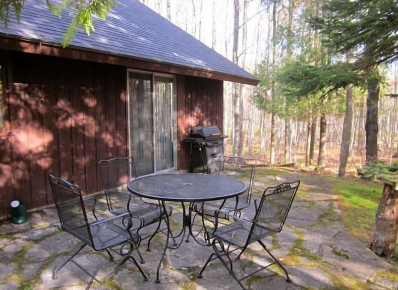 back yard with patio, sitting area and BBQ at Cozy Cabin in the Woods between Fish Creek and Ephraim, Wisconsin