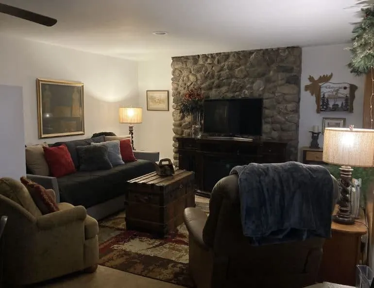 cozy sofas in front of the fire place at the Cabin on Eau Claire Chain of Lakes in Barnes, Wi