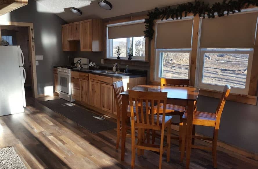 kitchen with dining table at Island hideaway with hot tub in Poynette, WI