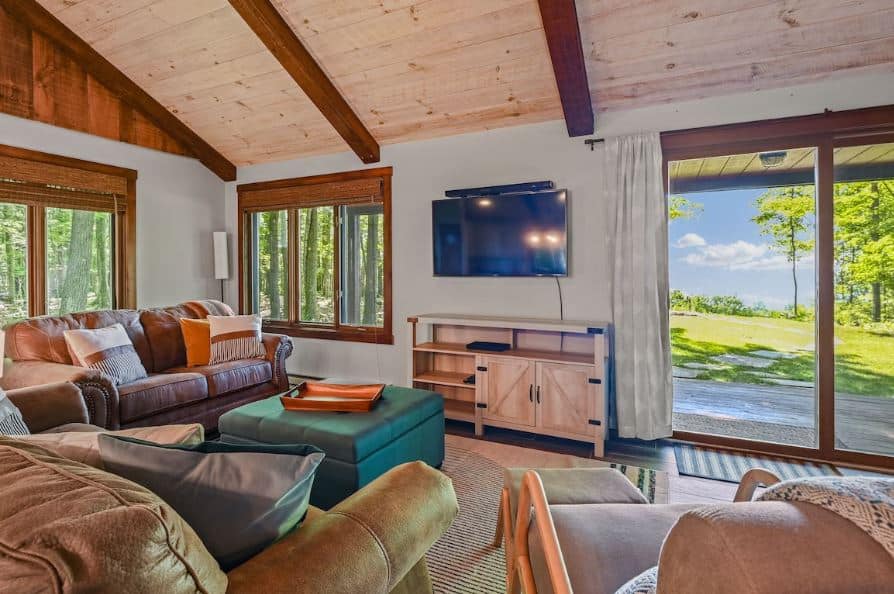 lovely living room with garden view at the Water Cabin with hot tub in Egg Harbor, WI